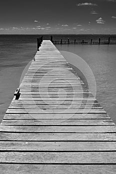 Lonely wooden pier in Caribbean Mexico photo
