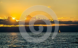 Lonely yacht on Lake Geneva at sunset in Switzerland