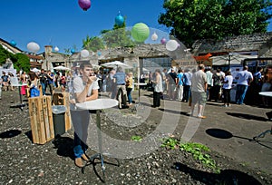 Lonely young man drink wine alone on festival