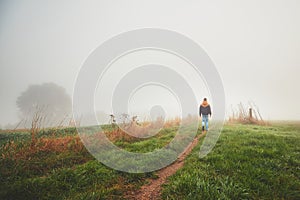 Lonely young man in mysterious fog