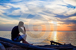 Lonely Young Man at Seaside