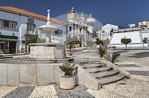 Square with fountain in small town Monforte. Portugal photo