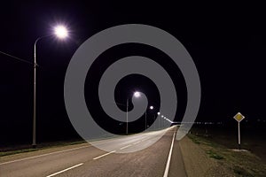 Lonesome asphalt road at night in summer