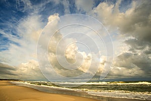 Lonesome beach of the Baltic Sea with cloudy sky