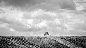 Lonesome farmer harvests the field
