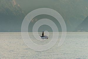 Lonesome fisherman on Traunsee in the evening