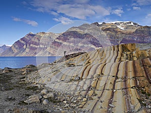 Lonesome man on colored rocks