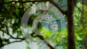 Lonesome paddle boat in the middle of the lake