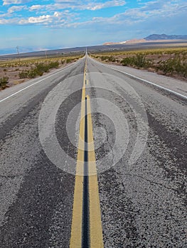 Lonesome stretch of highway at sunset