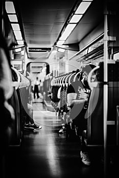 Long angle vieuw od a train interior in black and white photo