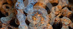 Long background with rusty industrial roller chain, soft focus