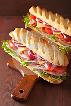 Long baguette sandwich with ham cheese tomato lettuce