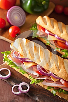 Long baguette sandwich with ham cheese tomato lettuce
