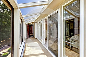 Long balcony interior with beige carpet floor