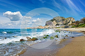 Long beach and blue sea near Cefalu, Sicily, Italy