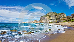 Long beach near Cefalu, town on Tyrrhenian coast of Sicily, Italy