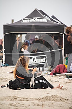 Long Beach, New York - September 13, 2018 : Unsound Pro photographer on the beach near an the event tent.
