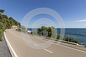 A long bike path overlooking the sea with no one around