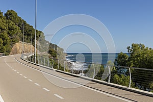 A long bike path overlooking the sea with no one around