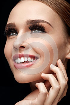 Long Black Eyelashes. Woman Face With Soft Skin, Beauty Makeup