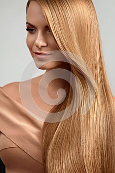 Long Blonde Hair. Beautiful Woman With Healthy Straight Hair