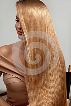 Long Blonde Hair. Beautiful Woman With Healthy Straight Hair