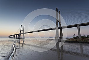 Long bridge over tagus river in Lisbon at sunrise