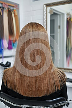 Long brown hair on woman in beauty salon