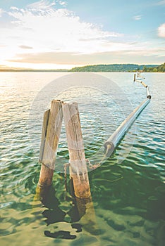 Long buoy in line in the lake when sunset