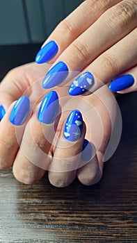 Long cat nails with blue gel polish