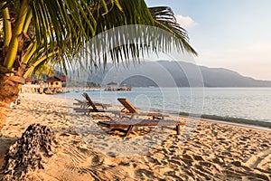 Long chairs on a beach in Pulau Tioman, Malaysia