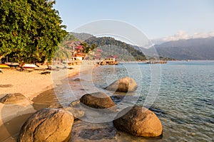 Long chairs on a beach in Pulau Tioman, Malaysia photo