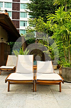 Long chairs by the pool