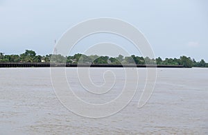 Long concrete embankment along the large river to protect the bank erosion