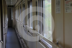 The long corridor of the compartment train, the transparent windows