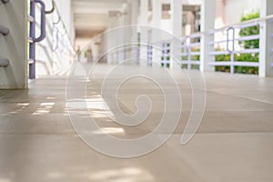 A long corridor connects the hospital building to the natural sunlight