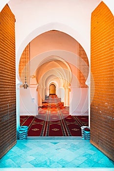 Long corridor with different types of arches in Moulay el Yazid Mosque. Islam and religion concept. Marrakech, Morocco