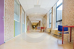 Long corridor with furniture in school building