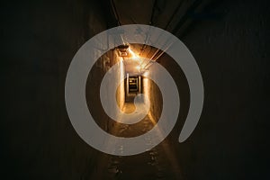 Long corridor or illuminated tunnel in bomb shelter, underground military bunker of cold war, perspective