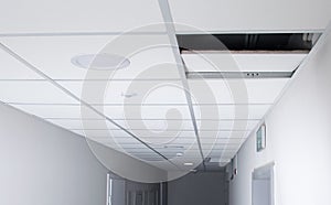 In the long corridor, the suspended ceiling plate is open, there is a place for the inscription