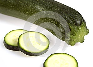 LONG COURGETTE OR ZUCCHINI cucurbita pepo AGAINST WHITE BACKGROUND