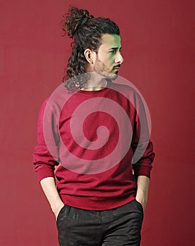 Long curly hair man posing with attitude and style