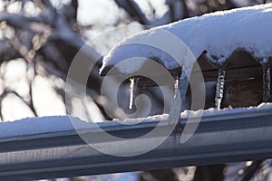 Long and dangerous icicles on a house roof