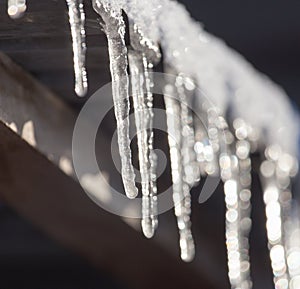 Long and dangerous icicles on a house roof