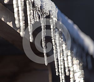 Long and dangerous icicles on a house roof