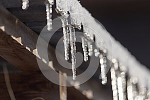 Long and dangerous icicles on a house roof