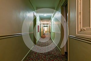 Long Dark and Creepy Hallway in an Old American Apartment Building