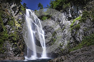 Long daytime exposure of the huge waterfall of Saut deth Pish in the Aran Valley, Catalan Pyrenees, Lerida, Spain