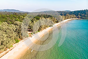 Long deserted beach with white sand and clear water. Aerial top view. Coast of island Koh Rong Samloem, Cambodia