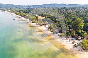 Long deserted beach with white sand and clear water. Aerial top view. Coast of island Koh Rong Samloem, Cambodia